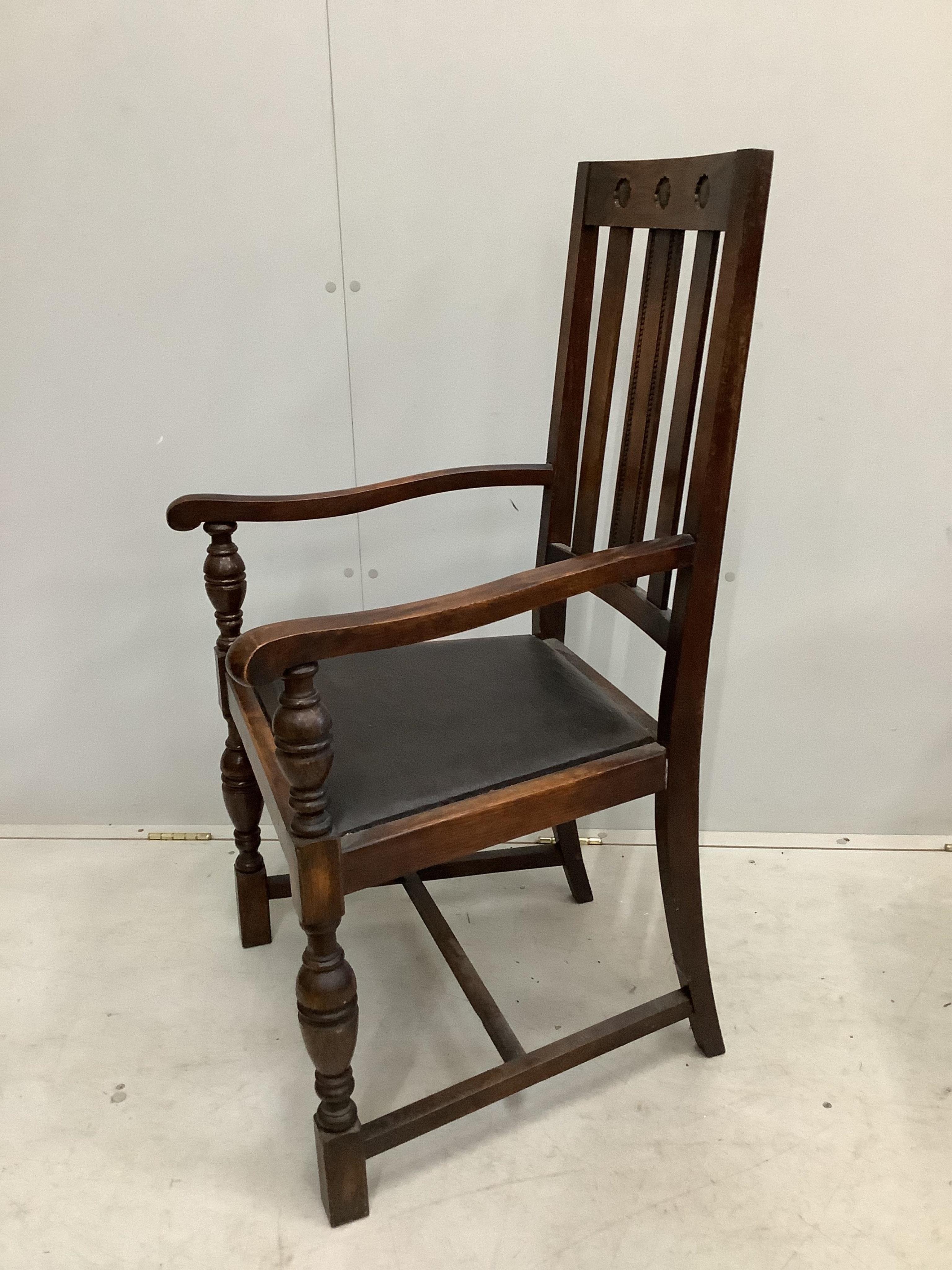 Eight 1920's oak dining chairs, two with arms